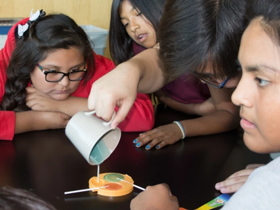 Visiting students making lollipops