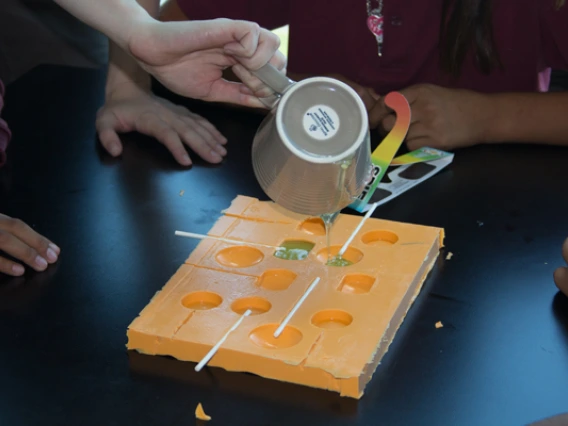 Visiting students making lollipops