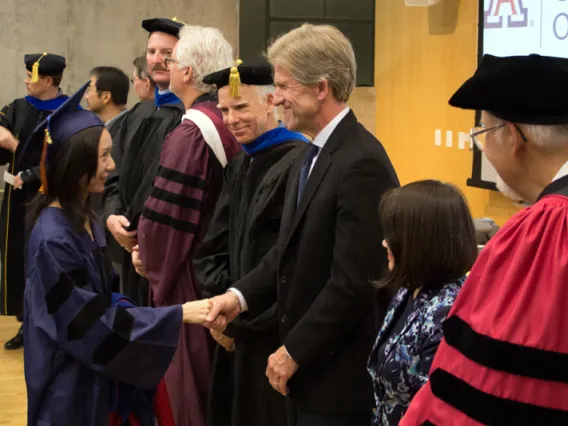 2015 Winter Commencement Student Shaking Hands with Board