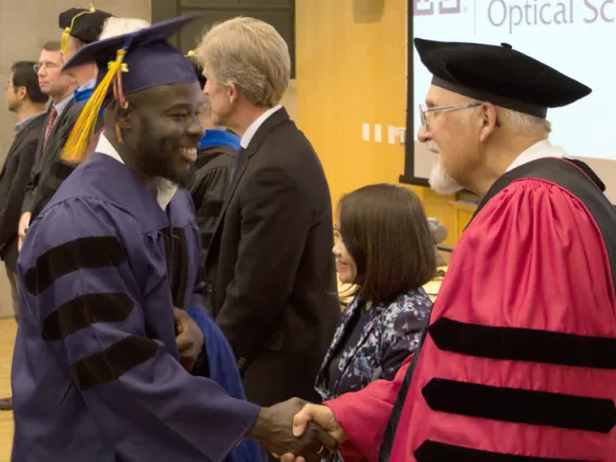 2015 Winter Commencement Student Shaking Hands with Board