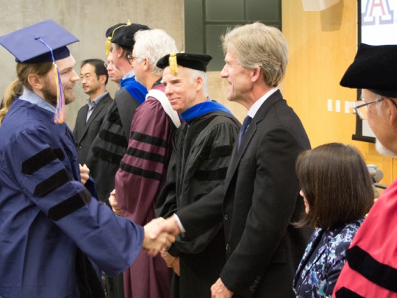 2015 Winter Commencement Student Shaking Hands with Board
