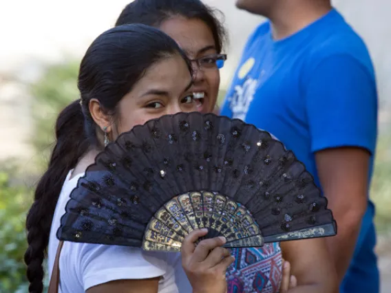 SOCK member holding fan