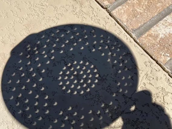 OSC PhD Alumna, 1991; Valorie Valencia, Backyard Partial Eclipse through a strainer