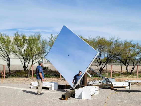 Man stands with Heliostat