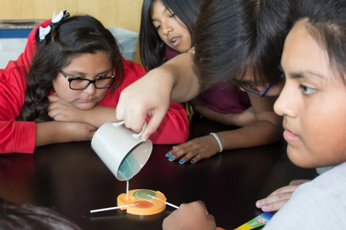 Visiting students making lollipops