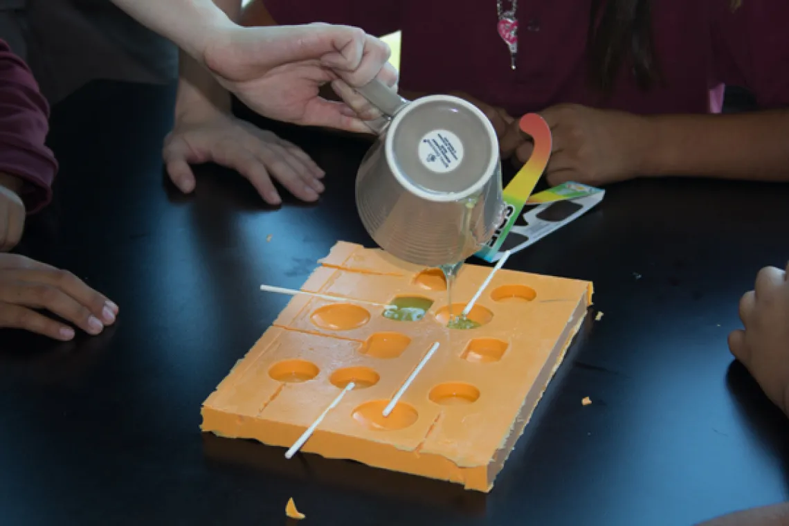 Visiting students making lollipops