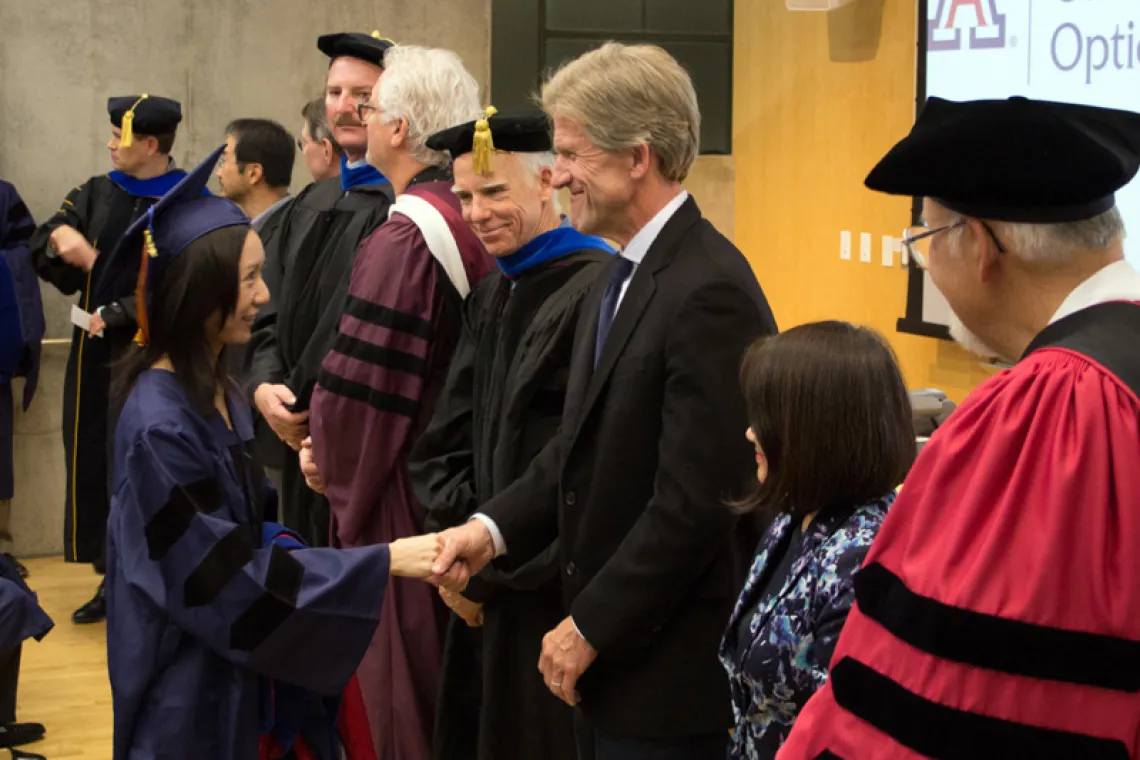 2015 Winter Commencement Student Shaking Hands with Board