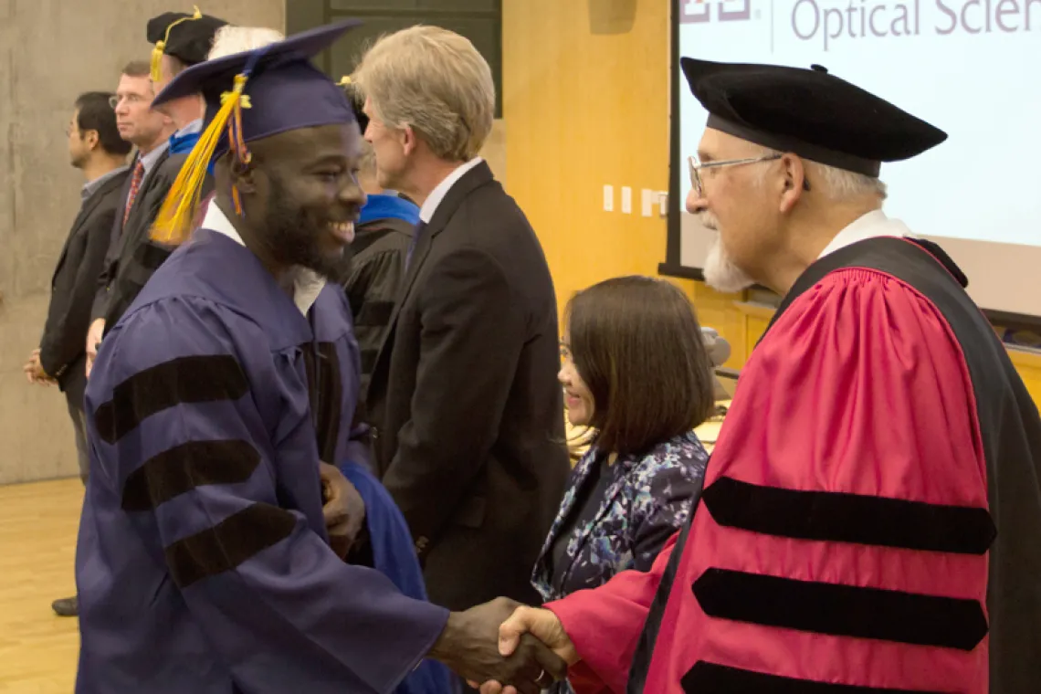 2015 Winter Commencement Student Shaking Hands with Board