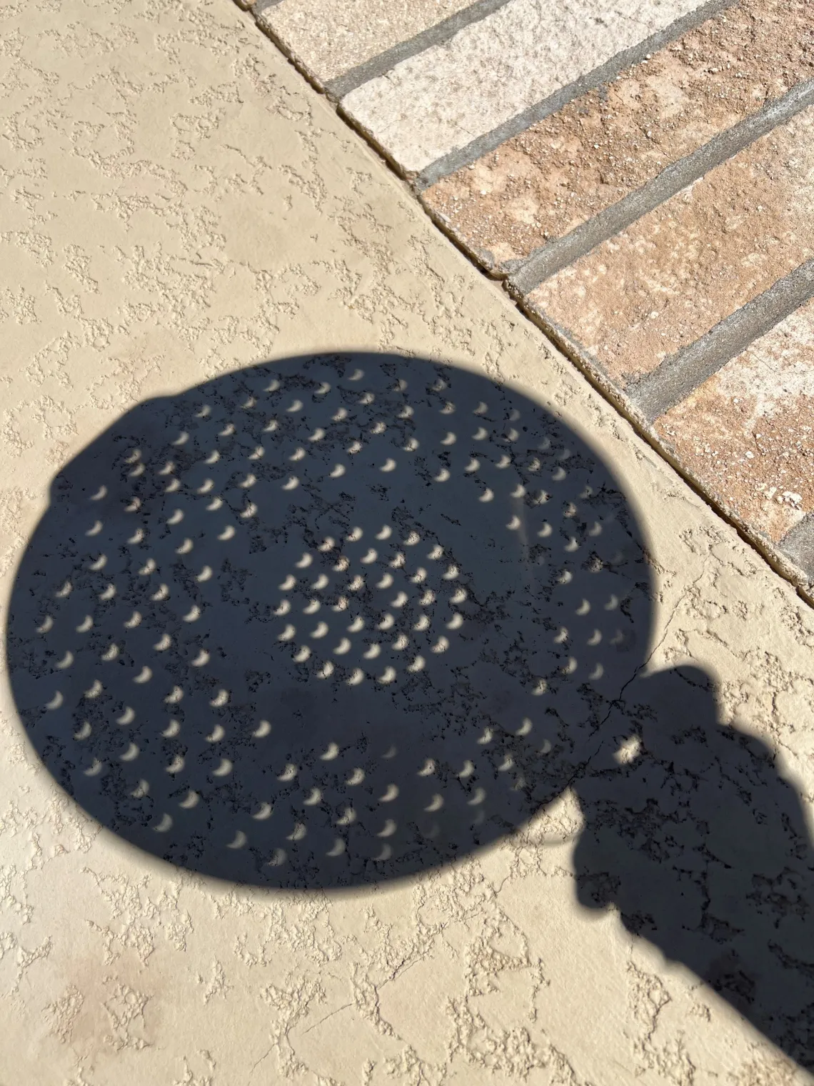 OSC PhD Alumna, 1991; Valorie Valencia, Backyard Partial Eclipse through a strainer