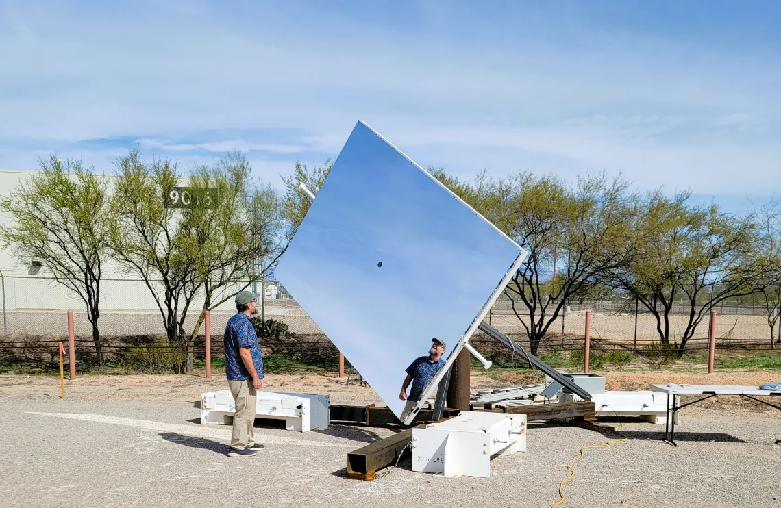 Man stands with Heliostat