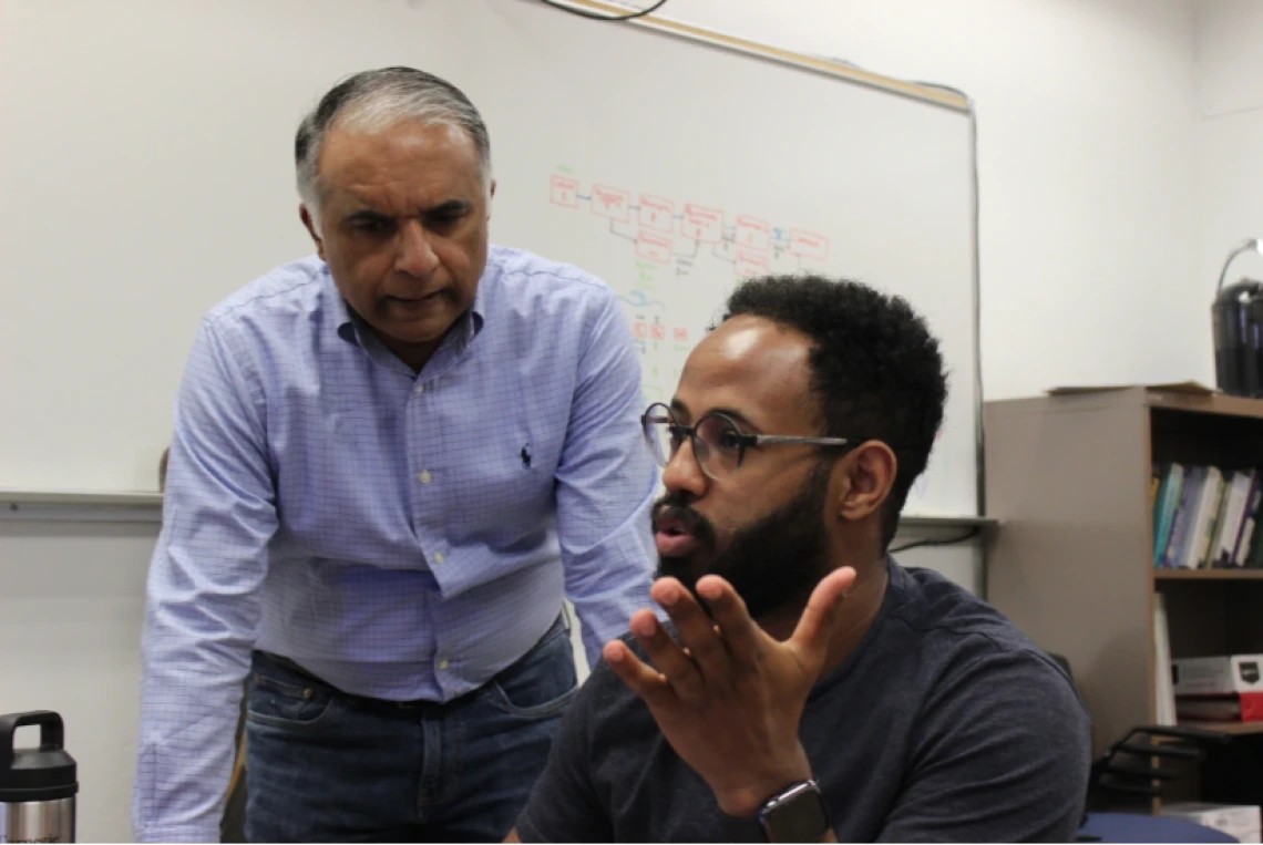 Left to right: Abhijit Mahalanobis with doctoral student Natnael Daba.